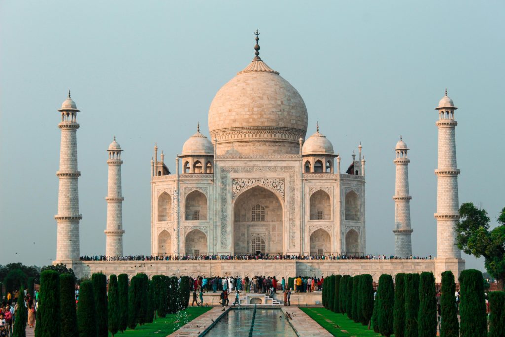 A stunning shot of the Taj Mahal in Agra, showcasing its iconic architecture and serene surroundings.