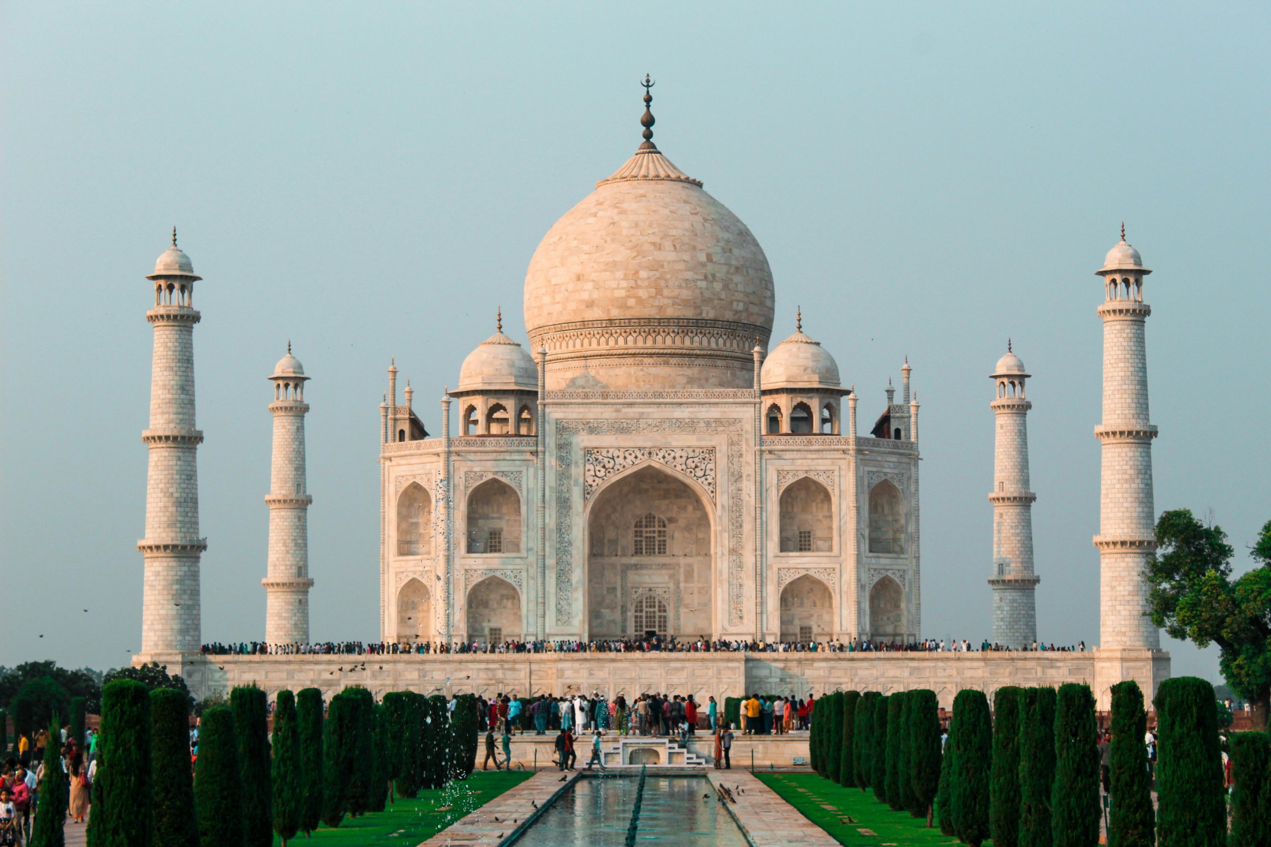 A stunning shot of the Taj Mahal in Agra, showcasing its iconic architecture and serene surroundings.