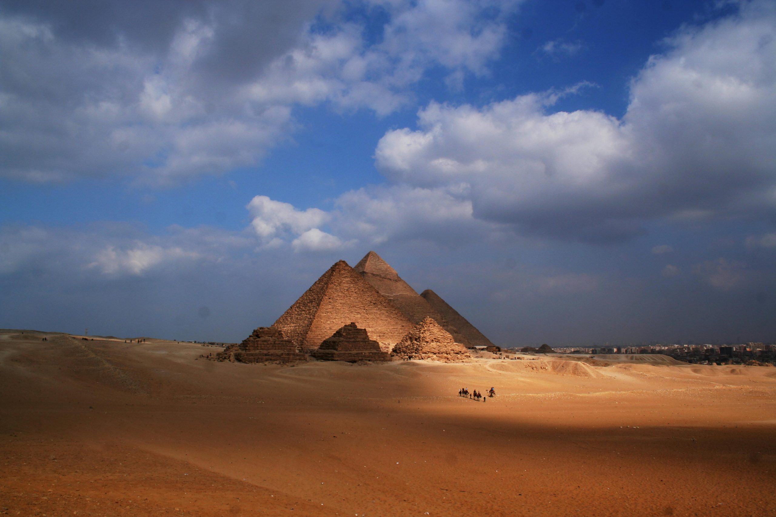 Amazing view of sandy dunes in desert with Pyramid of Cheops in Egypt